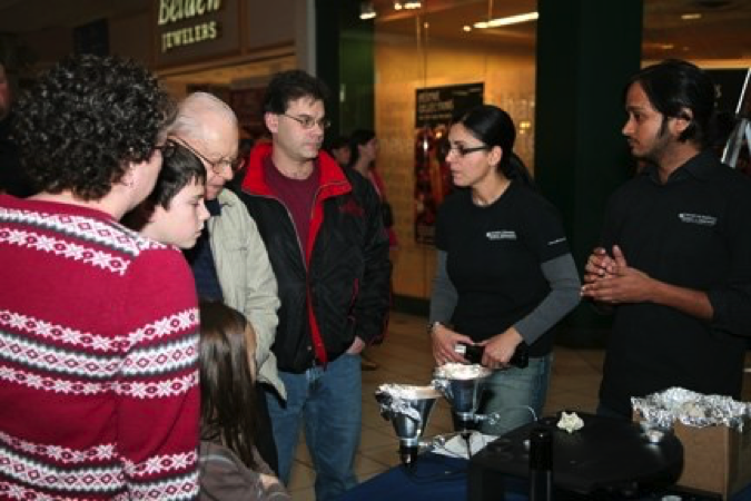 Visitors at the nano in the mall booth