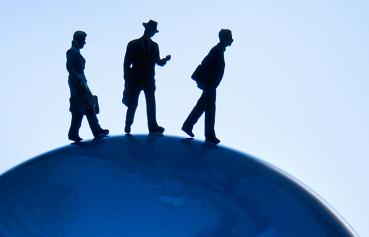 Business Administration - illustrative photo of people walking on globe